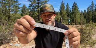 Man holding measuring tape